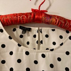 Polyester with black dots, bottom side bow tie, 3/4 sleeves & key hole neck.